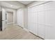 Hallway featuring multiple closets, offering ample storage solutions and neutral color scheme at 3561 Stone Dr, Marietta, GA 30062