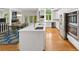 Modern kitchen with stainless appliances, white cabinetry, island, and a view to the dining area at 3561 Stone Dr, Marietta, GA 30062