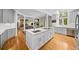 Spacious kitchen with large island, white cabinets, and modern appliances open to the living space at 3561 Stone Dr, Marietta, GA 30062
