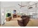 Spacious living room with vaulted ceiling, fireplace, large windows, and comfortable seating at 3561 Stone Dr, Marietta, GA 30062