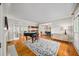 Elegant living room featuring a grand piano, hardwood floors, and bright, airy spaces with large windows at 3561 Stone Dr, Marietta, GA 30062