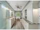 This main bathroom includes dual sinks, a soaking tub, a glass shower, and custom storage at 3561 Stone Dr, Marietta, GA 30062