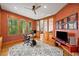 Well-lit home office with natural light, decorative wallpaper, and decorative, etched doors at 3561 Stone Dr, Marietta, GA 30062