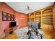 Home office featuring built-in shelving, hardwood floors, and unique patterned wallpaper at 3561 Stone Dr, Marietta, GA 30062