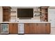 Basement wet bar with wine fridge, dishwasher, and granite countertop at 3561 Stone Dr, Marietta, GA 30062