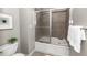 Bathroom features a shower-tub combo with sliding glass doors, offering comfort and style at 4810 Ivy Ridge Se Dr # 303, Atlanta, GA 30339