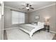 Cozy bedroom featuring neutral walls, a plush rug, and a modern ceiling fan at 4810 Ivy Ridge Se Dr # 303, Atlanta, GA 30339