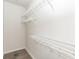Organized walk-in closet featuring wire shelving and hardwood floors at 4810 Ivy Ridge Se Dr # 303, Atlanta, GA 30339