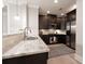 Well-appointed kitchen featuring granite counters, stainless appliances, and dark wood cabinetry at 4810 Ivy Ridge Se Dr # 303, Atlanta, GA 30339
