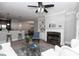 Open floor plan showcasing living room with fireplace, adjacent dining area, and kitchen bar at 4810 Ivy Ridge Se Dr # 303, Atlanta, GA 30339