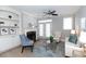 Cozy living room with fireplace, built-in shelves, and large windows for natural light at 4810 Ivy Ridge Se Dr # 303, Atlanta, GA 30339