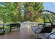Back deck features a hanging chair, grill, and seating area, perfect for enjoying the outdoors at 681 Braidwood Nw Ter, Acworth, GA 30101