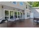 Spacious back deck with comfortable hanging chairs and a grill, perfect for outdoor dining at 681 Braidwood Nw Ter, Acworth, GA 30101