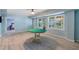 Bright basement area with tile floors, large windows, and a nearby seating area offers versatile living space at 681 Braidwood Nw Ter, Acworth, GA 30101