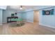Spacious basement with tile floors, a nearby seating area and a dart board for entertainment at 681 Braidwood Nw Ter, Acworth, GA 30101