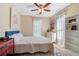 Comfortable bedroom with a ceiling fan, stylish decor, and an area rug that adds a touch of elegance at 681 Braidwood Nw Ter, Acworth, GA 30101