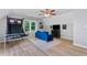 Spacious bonus room with vaulted ceilings, hardwood floors, and basketball arcade game at 681 Braidwood Nw Ter, Acworth, GA 30101