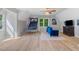 Spacious bonus room with vaulted ceilings, hardwood floors, and basketball arcade game at 681 Braidwood Nw Ter, Acworth, GA 30101