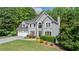 Charming gray two-story home with well-manicured lawn and lush landscaping at 681 Braidwood Nw Ter, Acworth, GA 30101