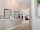 Well-decorated hallway leads to bedrooms at 681 Braidwood Nw Ter, Acworth, GA 30101