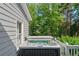 Close-up of a hot tub on the deck, surrounded by trees, offering privacy and relaxation at 681 Braidwood Nw Ter, Acworth, GA 30101