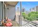 Private balcony includes seating, a view of the city, and wrought iron railings at 171 Auburn Ne Ave # 521, Atlanta, GA 30303