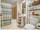 Bathroom features a shower-tub combo with sleek fixtures and a mirrored vanity at 171 Auburn Ne Ave # 521, Atlanta, GA 30303