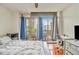 Bedroom with balcony access, hardwood floors, and a desk for a functional workspace at 171 Auburn Ne Ave # 521, Atlanta, GA 30303