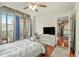 Bedroom featuring balcony, desk space, and seamless flow into the adjacent living area at 171 Auburn Ne Ave # 521, Atlanta, GA 30303