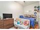 Bedroom featuring warm wood floors and a Captain America shield at 171 Auburn Ne Ave # 521, Atlanta, GA 30303