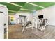 Apartment gym with free weights, machines, and green ceilings at 171 Auburn Ne Ave # 521, Atlanta, GA 30303
