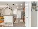 Open kitchen layout with stainless steel appliances and breakfast bar and stylish lighting at 171 Auburn Ne Ave # 521, Atlanta, GA 30303