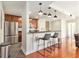 Charming kitchen with stainless steel appliances, breakfast bar, and dark cabinets at 171 Auburn Ne Ave # 521, Atlanta, GA 30303