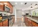 Modern kitchen with stainless steel appliances, dark countertops and wood cabinets at 171 Auburn Ne Ave # 521, Atlanta, GA 30303
