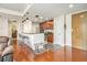 Well-lit kitchen features a breakfast bar, stainless steel appliances, and wood cabinets at 171 Auburn Ne Ave # 521, Atlanta, GA 30303