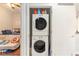 Stackable washer and dryer units sit by the main bedroom in laundry room at 171 Auburn Ne Ave # 521, Atlanta, GA 30303