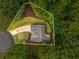 Aerial view of a home nestled in a lush, green landscape, featuring a winding driveway and ample yard space at 2109 Tranquility Ct, Woodstock, GA 30188