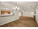 Open-concept dining area connected to kitchen and living spaces, filled with natural light at 2109 Tranquility Ct, Woodstock, GA 30188