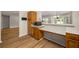 Kitchen with wood cabinets and countertop that opens to living room at 2109 Tranquility Ct, Woodstock, GA 30188