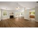 Bright and airy living room with hardwood floors, fireplace, and French doors to the backyard at 2109 Tranquility Ct, Woodstock, GA 30188