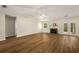 Spacious living room featuring a vaulted ceiling, fireplace, and hardwood floors at 2109 Tranquility Ct, Woodstock, GA 30188