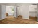 View from main bedroom of ensuite bathroom, dual closets, and wood-look flooring at 2109 Tranquility Ct, Woodstock, GA 30188