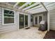 Covered outdoor patio area with concrete flooring, grill, and siding at 2109 Tranquility Ct, Woodstock, GA 30188