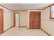 Finished basement with wood trim featuring a closet with sliding doors at 3550 Miller Farms Ln, Peachtree Corners, GA 30096