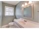 Clean bathroom with a single vanity, a well-lit mirror, and a window at 3550 Miller Farms Ln, Peachtree Corners, GA 30096