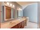 Bathroom with dual sinks, neutral tones, and great lighting at 3550 Miller Farms Ln, Peachtree Corners, GA 30096