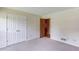 Bright bedroom featuring a large double-door closet for storage at 3550 Miller Farms Ln, Peachtree Corners, GA 30096