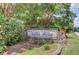 The 'Miller Farms' neighborhood sign is framed by stone and lush landscaping, offering a welcoming entrance at 3550 Miller Farms Ln, Peachtree Corners, GA 30096