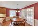 Cozy dining room with hardwood floors, chandelier, and access to outdoor space through french doors at 3550 Miller Farms Ln, Peachtree Corners, GA 30096