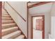 Hallway features carpeted stairs and a doorway leading to another room at 3550 Miller Farms Ln, Peachtree Corners, GA 30096